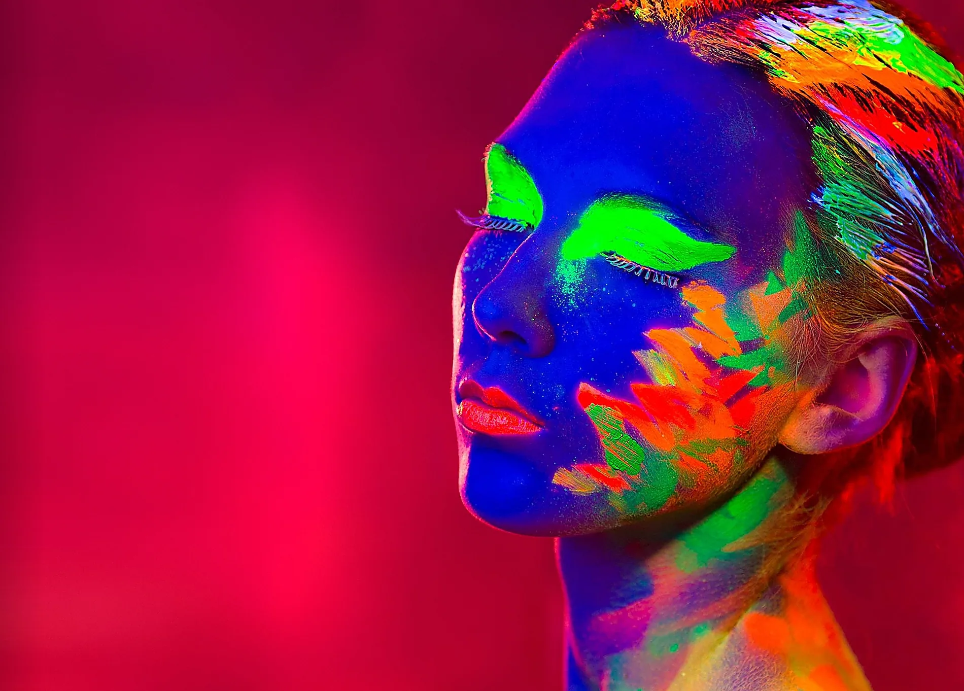 A portrait lit in saturated colour