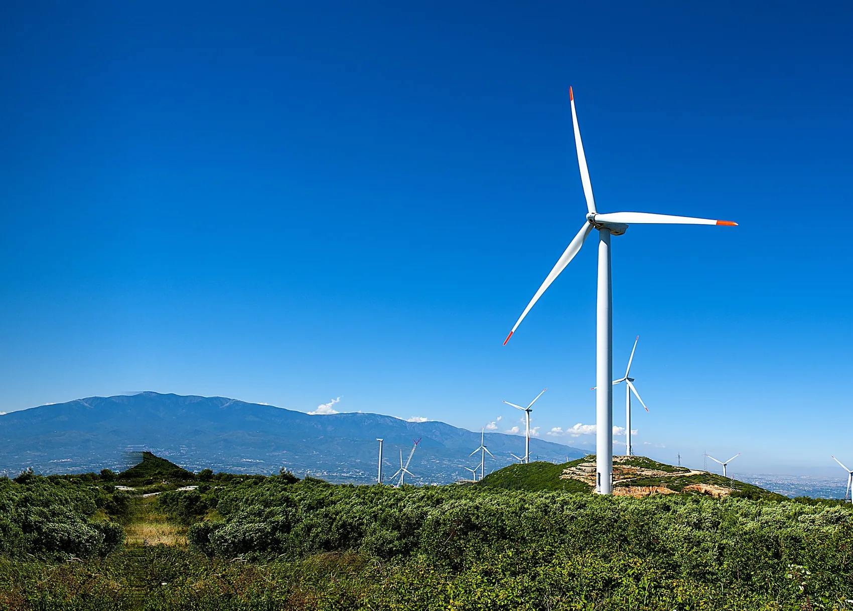 A wind turbine on a hillside