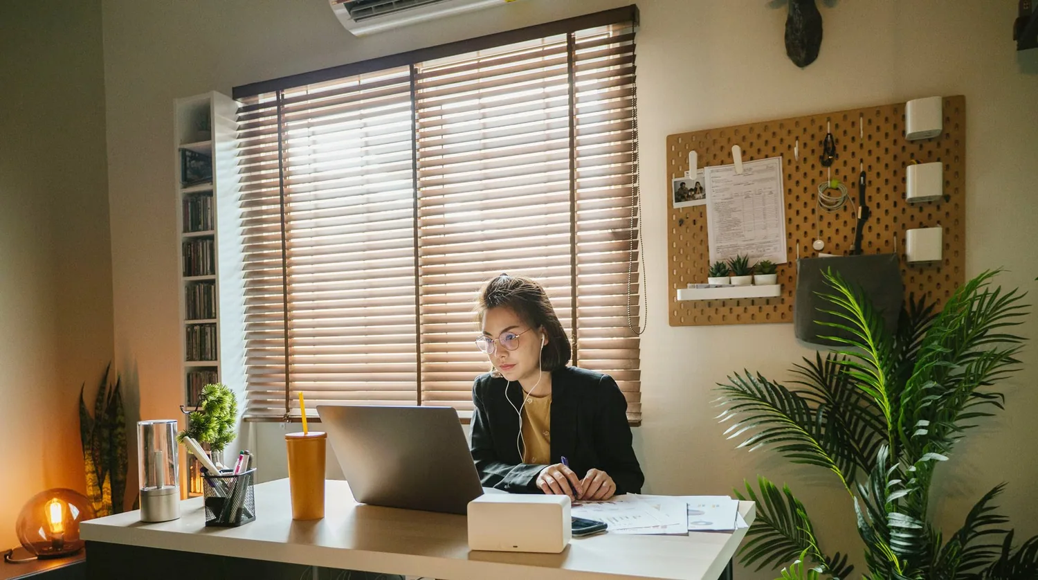 Someone working at a laptop at home